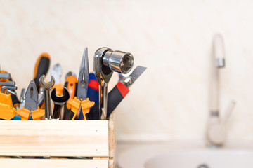 construction tools in wooden box in kitchen