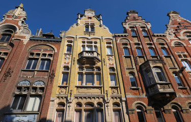 Fototapeta na wymiar Traditional architecture with vivid facade of tall houses in Ghent.