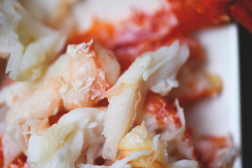 Crab meat on white plate for cooked seafood - Close up of steamed crab alaskan
