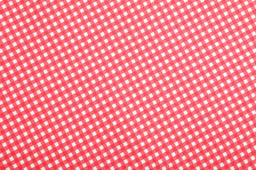 Checkered picnic tablecloth as background, top view