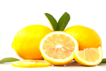 fresh lemon with lime and leaves on white background