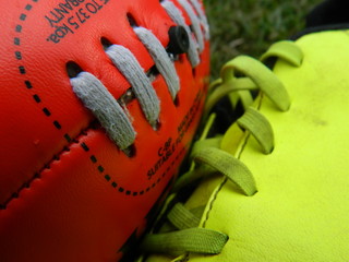 Close up of a football and a boot