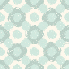Grunge polka dot. Grungy dotted seamless pattern. Textured circles on beige background. Vector illustration.