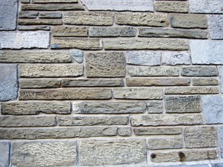 Old stone wall with various block sizes and colors background