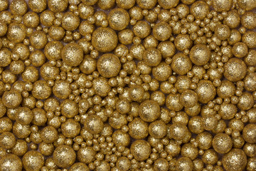 Christmas background with big and small golden glitter globules