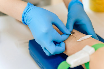 Biochemical analysis of blood in women. HIV test for a young girl. A blood sample from a vein for...