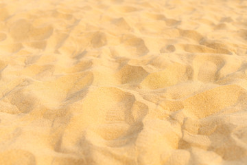 Closeup of sand pattern of a beach in the summer