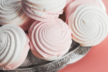 Zephyr or marshmallow on pink background.