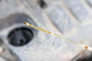 Car dipstick for oil level measurements. Checking the parameters of the car engine.