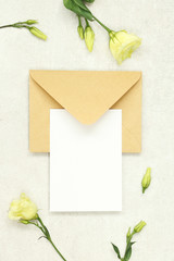 Invitation card on grey background with envelope