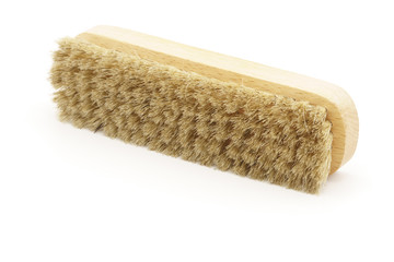 Horsehair brush on white background. Leather shoe polishing. Cleaning. Wax
