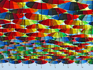 many colored umbrellas in the sky. Multicolored background. Umbrella. Weather       