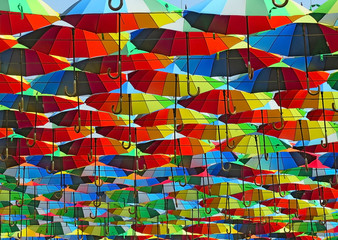 many colored umbrellas in the sky. Multicolored background. Umbrella. Weather       