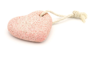 Natural pumice stone on white background. Feet care concept, pedicure and spa. Copy space