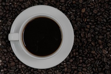 Coffee cups and coffee beans on top