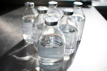 bottles with solutions on the medical table. concept of pandemic, coronavirus, virus, disinfection, panic.