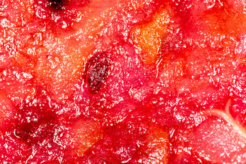 Red fruit jam as abstract background