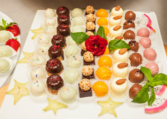 Assortment, variety of sweet colorful truffles and mignons