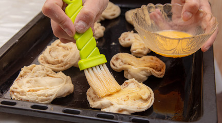 The hostess prepares the pies in the kitchen
