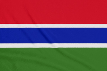 Flag of Gambia on textured fabric. Patriotic symbol