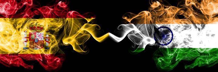 Spain vs India, Indian smoky mystic flags placed side by side. Thick colored silky smokes flag of Spanish and India, Indian