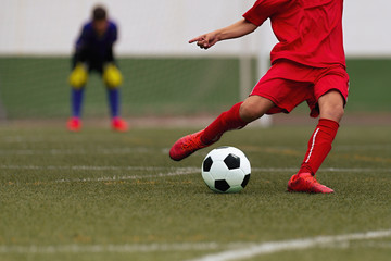 Kids playing soccer tournament game, kicking football on the sports field