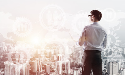 Concept of business success and control with confident boss against cityscape background