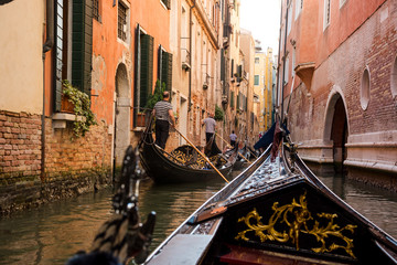 The front part of the gondola under the bridge of Venice. Gondoliers driving the gondola © allai