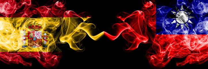 Spain vs Taiwan, Taiwanese smoky mystic flags placed side by side. Thick colored silky smokes flag of Spanish and Taiwan, Taiwanese