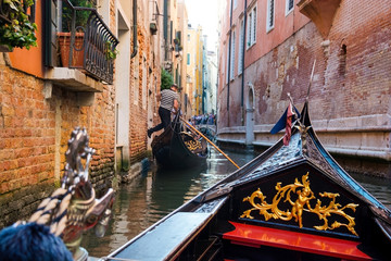The front part of the gondola under the bridge of Venice. © allai