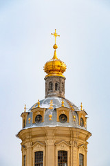Fototapeta na wymiar Dome of Peter and Paul cathedral located in Saint-Petersburg, Russia. Famous landmark in winter day
