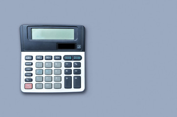 Flat lay or top view of calculator on viollet background paper with blank copy space, math, cost,...