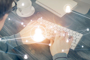 Social network theme hologram with businessman working on computer on background. Multi exposure.