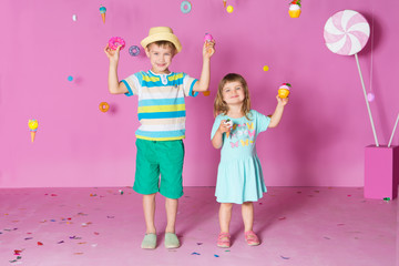 two children with happy birthday cupcake. Kids have a birthday party.
