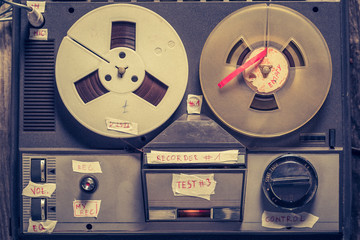 Top view of reel audio recorder with rolls of tape