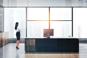 Fototapeta na wymiar Businesswoman in panoramic CEO office