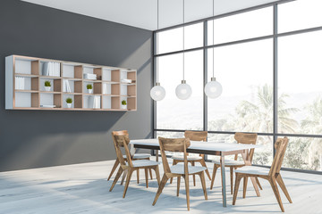 Gray dining room corner with shelves