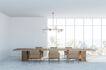 White dining room interior with armchairs