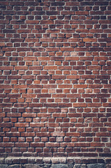 Color toned picture of a dark brick wall