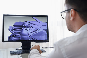 Engineer, Constructor, Designer, Architect in Glasses Working on a Personal Computer. He Creating...