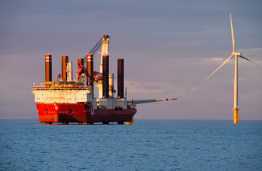 Specialised jack up ship MPI Adventure erecting offshore wind farm near Coatham, Redcar, England