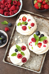 Mini Pavlova cakes with fresh berries
