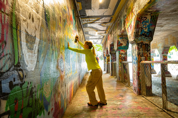 Spray Painting Graffiti in Krog Street Tunnel, Atlanta, Georgia