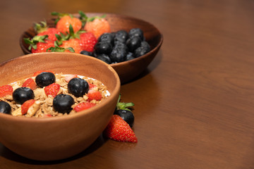Fresh cereal and milk with strawberry and blueberry in bowl