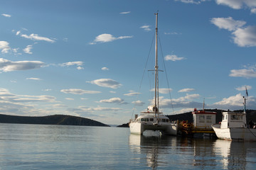 Seascape with big white catamaran yacht boat, vacation destination
