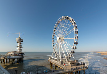 Sunny day on North sea beach in Netherlands in Schegeningen, tourist and vacation destination in Europe