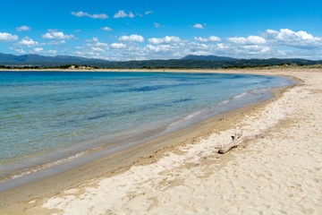 Voidokilia Beach, popular white sand and blue clear water beach in Messinia in Mediterranean area in shape of Greek letter omega, Peloponnese, Greece.