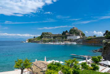 Harbor and yachts by Old Fortress in the town of Corfu - obrazy, fototapety, plakaty