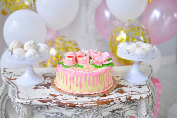 Cake with candles and flowers.