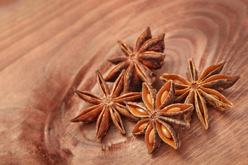 Anise star or anisetree spice on wood